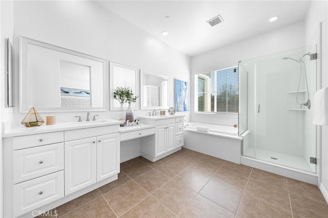 bathroom with tile patterned floors, visible vents, a garden tub, a shower stall, and vanity