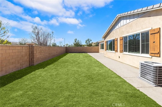 view of yard featuring cooling unit and a fenced backyard