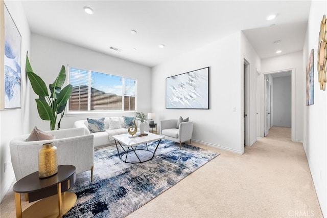 living room featuring recessed lighting, visible vents, and light colored carpet