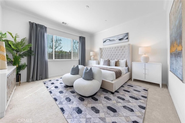 bedroom with visible vents, light carpet, and crown molding