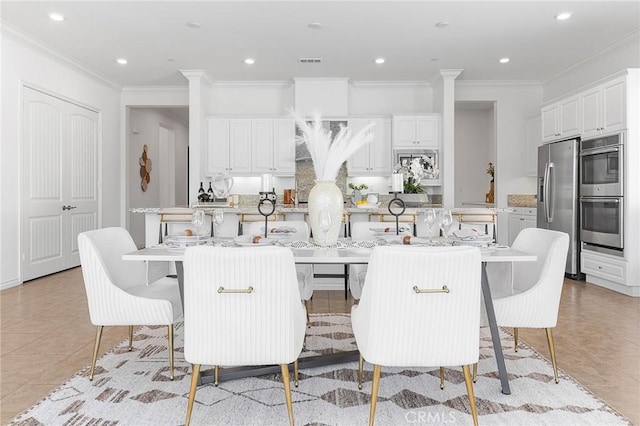 dining room featuring light tile patterned floors, visible vents, recessed lighting, and ornamental molding