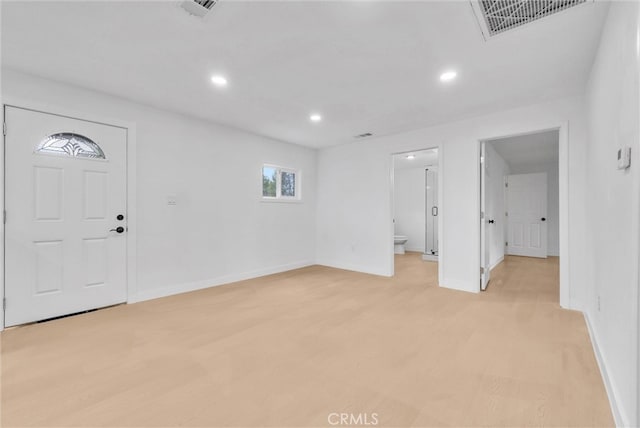 entrance foyer featuring visible vents, recessed lighting, light wood-style flooring, and baseboards