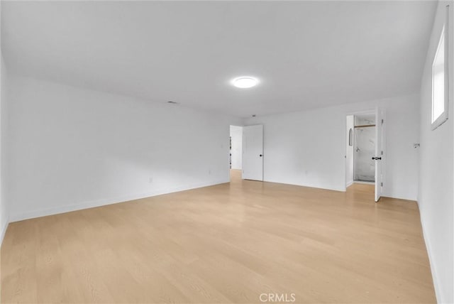 unfurnished room with light wood finished floors