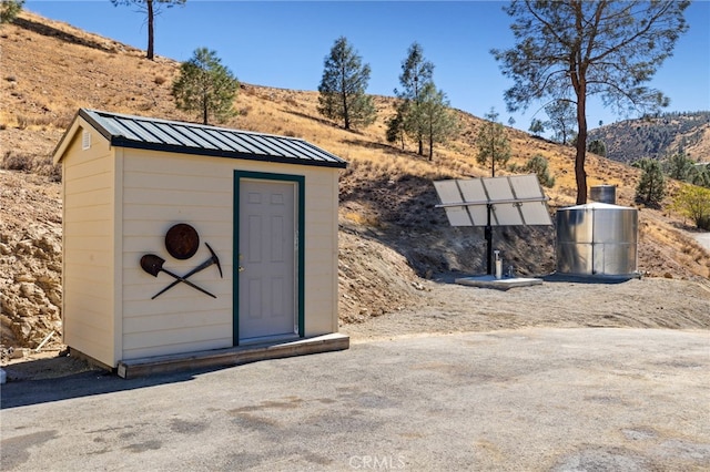 view of shed featuring a mountain view