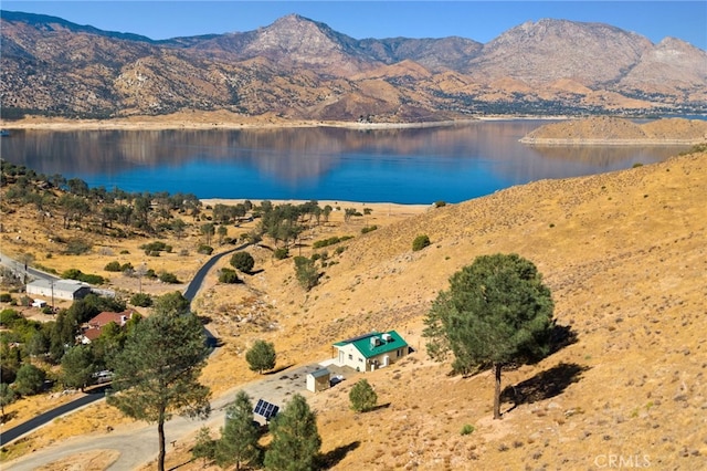 drone / aerial view with a water and mountain view