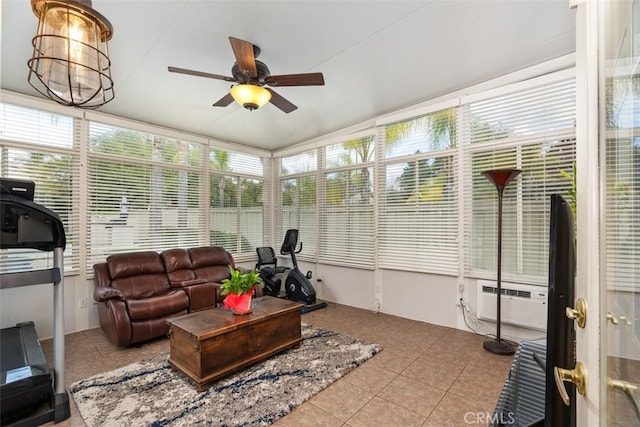 sunroom / solarium featuring ceiling fan