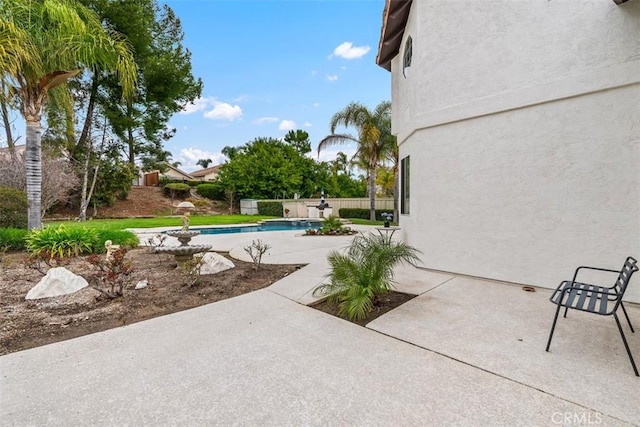 view of patio / terrace featuring fence and a fenced in pool