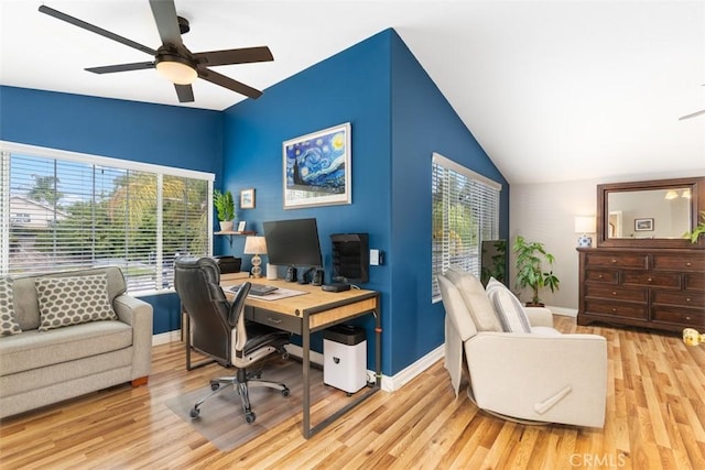 office space featuring baseboards, a ceiling fan, lofted ceiling, and wood finished floors