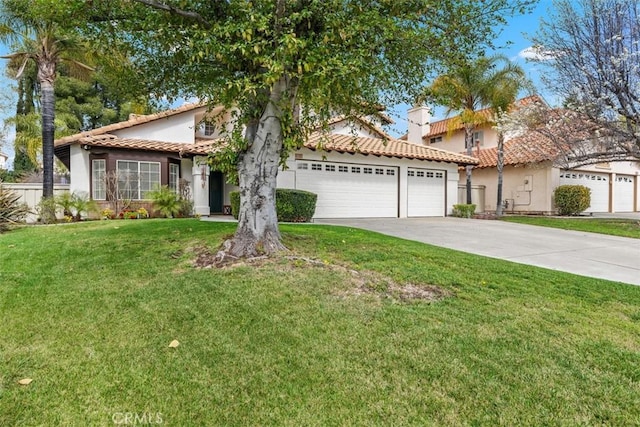 mediterranean / spanish-style house featuring an attached garage, stucco siding, a front lawn, concrete driveway, and a tiled roof