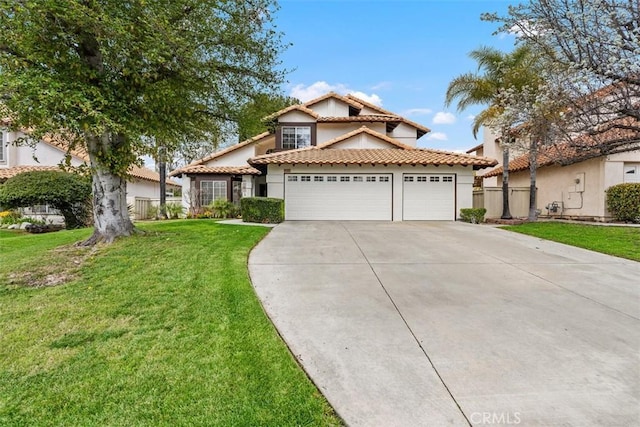 mediterranean / spanish-style home with stucco siding, driveway, a front lawn, a garage, and a tiled roof