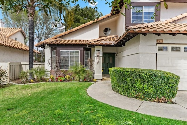 mediterranean / spanish-style house with a tile roof, stucco siding, a garage, and a front lawn