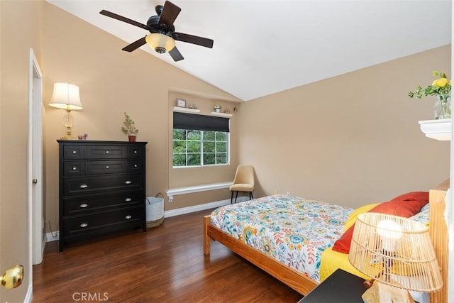 bedroom with a ceiling fan, vaulted ceiling, wood finished floors, and baseboards