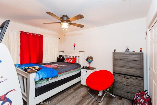 bedroom featuring ceiling fan and wood finished floors