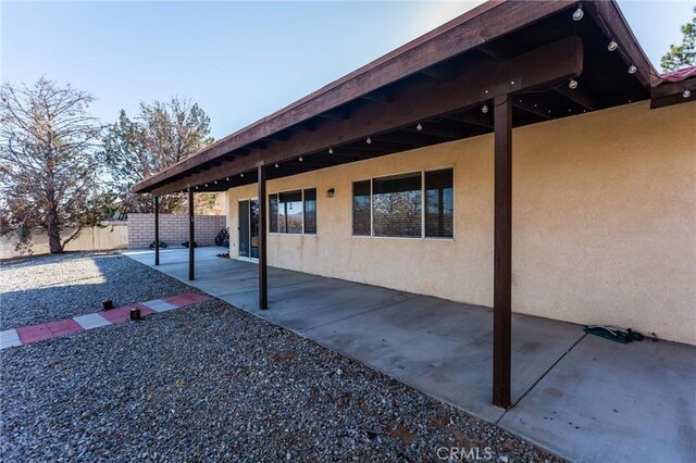 view of patio featuring fence