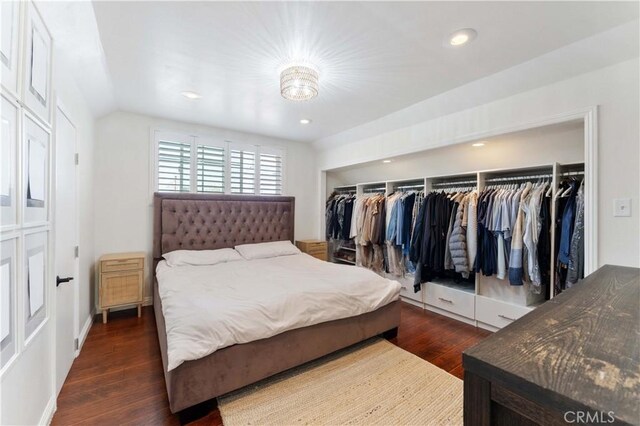 bedroom featuring dark wood finished floors, recessed lighting, and a closet