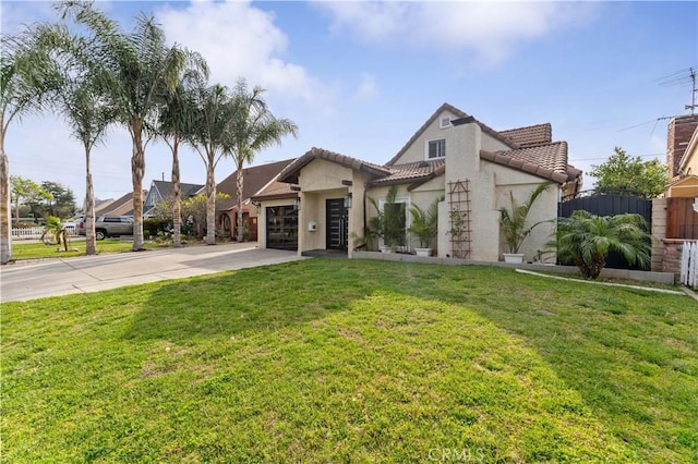 mediterranean / spanish-style house with stucco siding, driveway, a front yard, and a garage