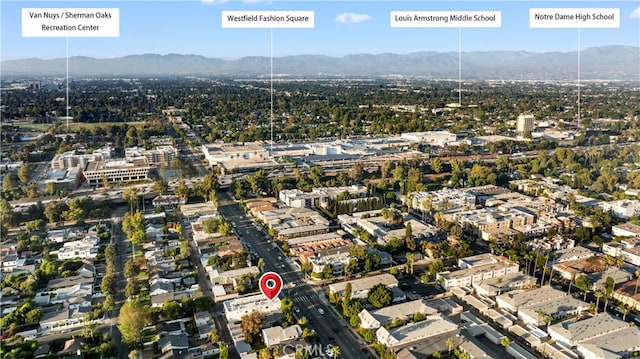 drone / aerial view featuring a mountain view