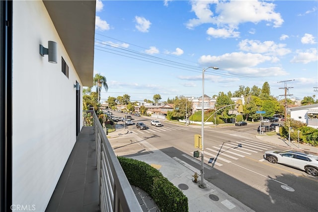 exterior space with curbs, street lighting, and sidewalks