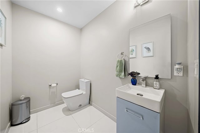 half bath with tile patterned floors, baseboards, toilet, and vanity