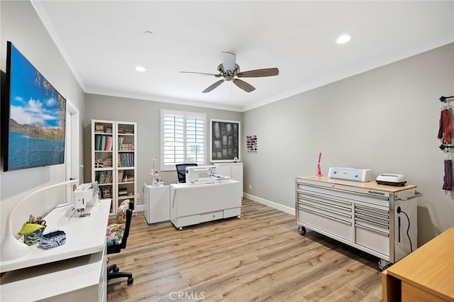 office with crown molding, baseboards, light wood-style flooring, washer / clothes dryer, and a ceiling fan