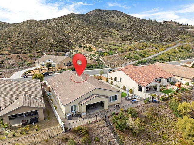 aerial view featuring a mountain view and a residential view