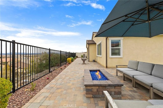view of patio / terrace with an outdoor living space and a fenced backyard