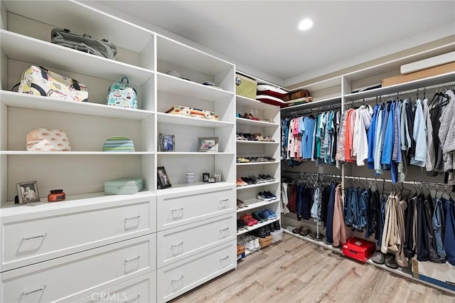 walk in closet featuring light wood-style flooring