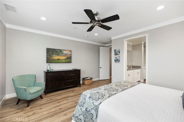 bedroom with recessed lighting, visible vents, crown molding, and light wood finished floors