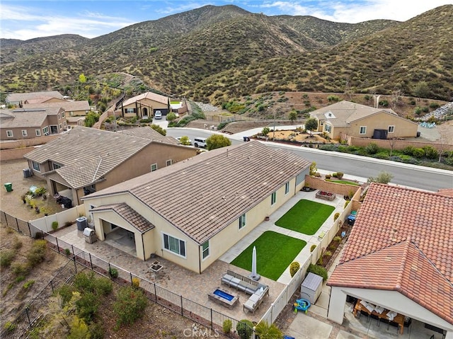 drone / aerial view featuring a mountain view and a residential view