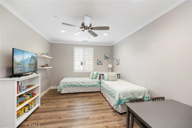 bedroom with recessed lighting, a ceiling fan, light wood-style flooring, and crown molding