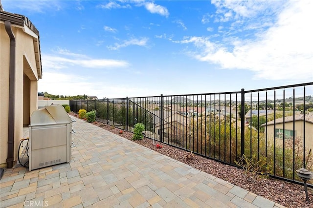 view of patio / terrace featuring fence