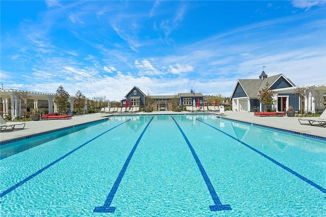 pool with a pergola and a patio