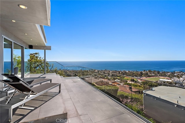 balcony featuring a water view