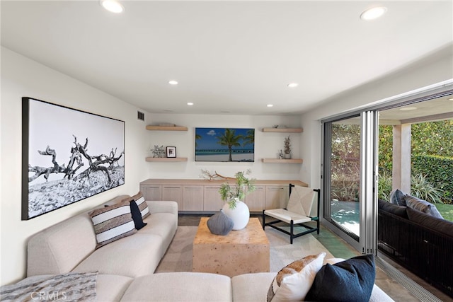 living room with recessed lighting and visible vents