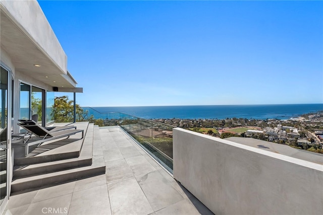 balcony featuring a water view