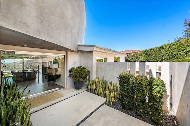 view of patio / terrace featuring fence