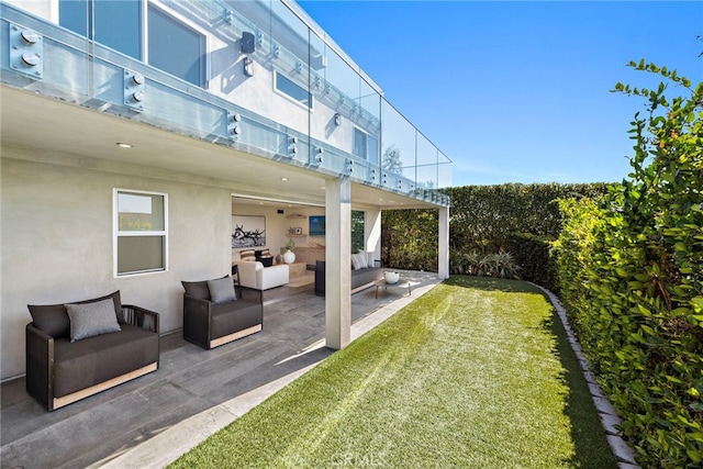 view of yard with an outdoor living space and a patio area