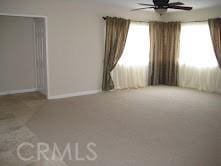 unfurnished room with ceiling fan