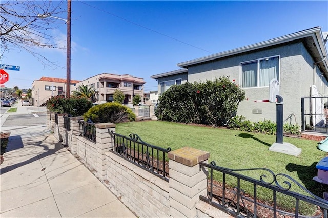 exterior space featuring a fenced front yard