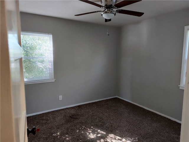 unfurnished room with ceiling fan, carpet flooring, and baseboards