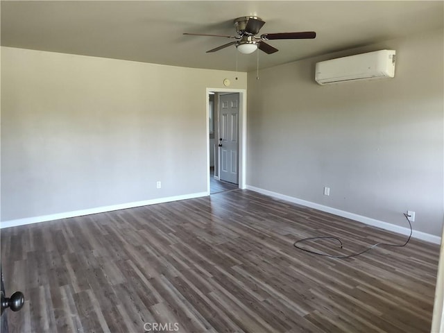 unfurnished room featuring ceiling fan, baseboards, dark wood-type flooring, and a wall mounted AC