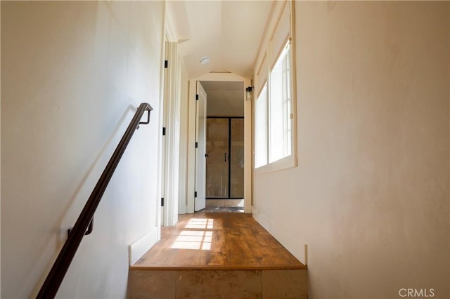 hall with vaulted ceiling