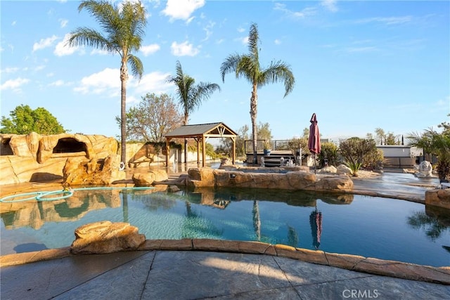 pool featuring a gazebo and fence