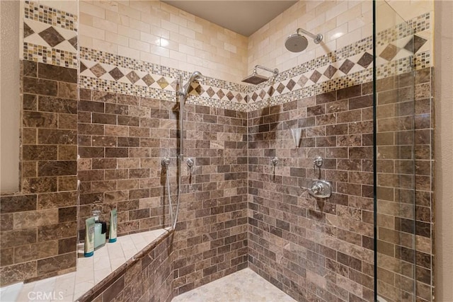 full bath with a tile shower