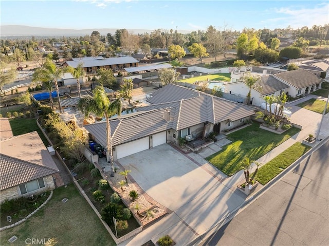 birds eye view of property with a residential view