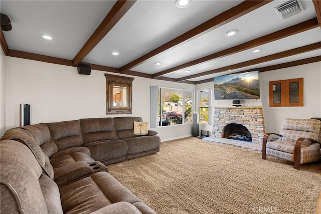 carpeted living room with baseboards, visible vents, beam ceiling, recessed lighting, and a stone fireplace