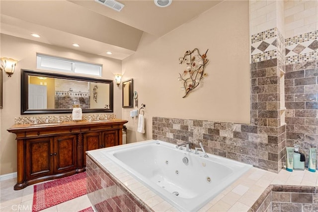 full bath featuring tile patterned flooring, visible vents, double vanity, a tub with jets, and a sink