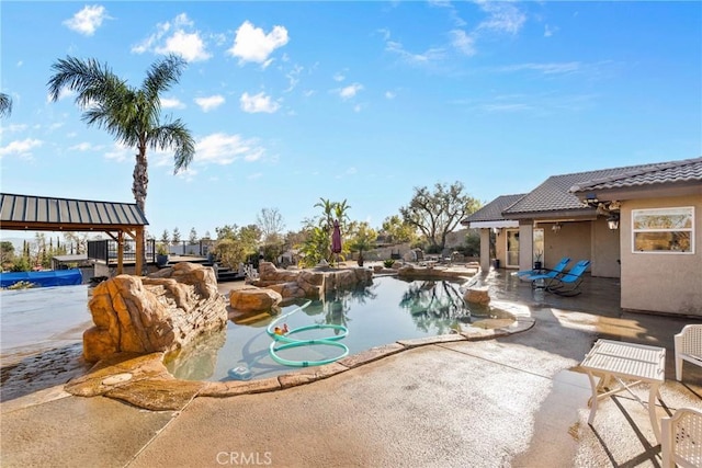 outdoor pool featuring a patio area