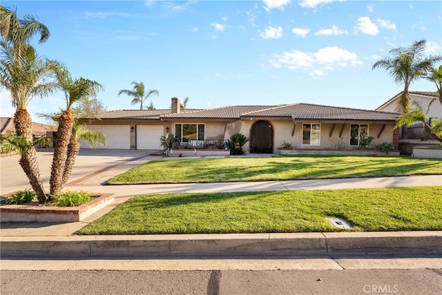 ranch-style home with stucco siding, a front lawn, a tile roof, a garage, and a chimney