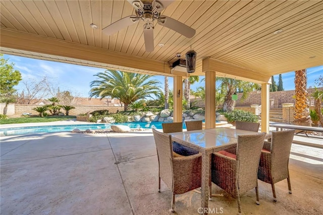 view of patio / terrace with a fenced backyard, a ceiling fan, and a fenced in pool